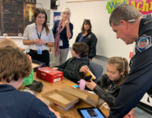 Officers Deliver Shoeboxes